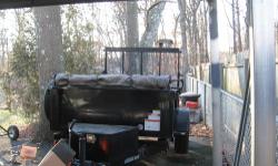 Black dump trailer with landscaper's gate, spare tire, tongue jack, roll up tarp cover and 4 heavy-duty floor mount tie-down rings. Gate has been modified for use as a workbench as well. Capacity: 3-1/2 cu yds - mulch or 2 tons - gravel.
2 (two)