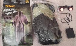 Fading Eyes Ghoul Robe Scary Men's adult Halloween Costumes by Spirit
Includes: long black robe with gauze draped all over it, rope belt, black gloves, and awesome mask with electronic fade in and out eyes.
( One Size fits All ) Gauze Zombie
$25 (