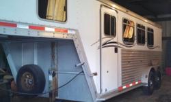 2003 Featherlite aluminum 3 horse slant gooseneck with removable tack area - wall folds shut & saddle racks can mount in dressing room. Removable stall dividers. Can use nose of trailer for sleeping area or storage. Dressing room has a grooming box, bars