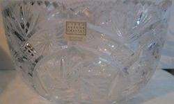 approx. 5 1/2" x 9"
24% Lead Crystal
Made in Poland
rim is scalloped & saw toothed
the bottom has a large star burst
the sides are decorated with a variety of pinwheels, starbursts, diamond pineapples & crisscrosses
no chips or cracks
no original