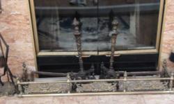 Solid brass gate rail is heavy. 42" x 8" deep. Log holders are 20" highX14" deep asking $150.00. All are solid brass. Very elegant pieces.