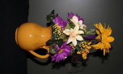 I am enjoying making silk and dried flowers arrangements of different styles and sizes ....I've attached photos but I will take orders according to your preference. Just let me know of the colors, the price you want to pay and for which room it is and I