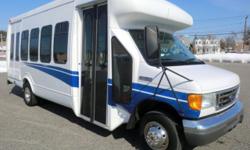 Excellent condition 2006 Ford E-450 Startrans fiberglass body shuttle bus for 20 passengers and 2 wheelchairs plus driver. This beautifully maintained bus has a rugged Triton 6.8L V-10 engine which delivers superb performance and power under load. This