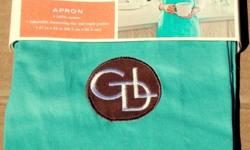 Giada De Laurentiis Full Kitchen Apron
Color: Blue Apron with Brown Patch & White Embroidered Logo 'GDL' (Giada De Laurentiis) on Front
Triple Section Front Pocket
Adjustable Brown Drawstring Ties - "Simply Pull on the Drawstring Ties, and it