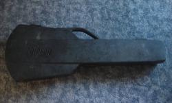 Original Gibson Guitar Case
It's a hardshell on the outside with the GIBSON print on it.
Color: Black
Inside: Maroon/Dark Red
I was told the style is called CHAINSAW.
Has 3 latches to close the case, all 3 seal tight.
This case used to be the home of a