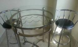 This modern glass and chrome table set in like-new condition is available with complimenting bar stools.*
The table includes a built-in wine rack. Chairs swivel.
No visible signs of wear.
I'm moving and looking for a new home for this beautiful piece of