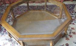 Beautiful glass and iron coffee table purchased from Ethan Allen approximately 10 years ago for $1000.00 Mint condition with no scratches to the glass. Table is 44" diameter, 18" high. Neutral/transitional piece that would work with almost any decor -