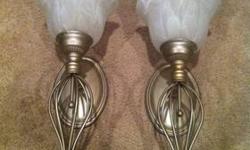 Fine crafted metal and glass sconces that hang on the wall. Holds candles or hang without for beautiful decor.