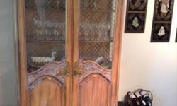 GORGEOUS custom built wood china cabinet with two front doors with French handles. It has side and front glass panels in the upper half of the unit. The front glass panels have beautiful metal mesh design in front of the glass. There are three shelves for