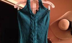 Gorgeous Hand Knit (by me) cotton tank top Turquoise size S size S. 100% mercerized cotton. Dark aqua color. Unique center knit braid which becomes neckline. Backless. Prob best fits 34B or C. Like new. Barely worn as I had to knit myself a smaller one.