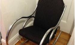 Here is a gorgeous mid-century modern chrome raised Thonet style rocking lounge chair. This rocker has the perfect mix of shapes, forms and is very comfortable. It has a really cool chrome frame as you can see in the photos. This rocker is an excellent
