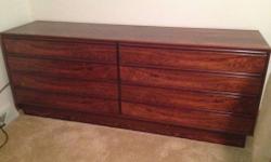 Beautiful gleeming deep color rosewood, Clean-lined Scandanavian import in excellent condition. All drawers are dovetailed. 27 1/2" H, 18"D, 71 1/2"L. A piece like this is difficult to find.