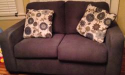 Grey sofa and loveseat, with large pillows to go with it. Good condition. Please call me or text.