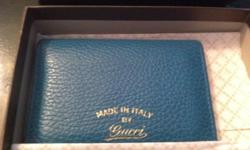 For sale is a beautiful aqua colored unisex wallet by Gucci. The wallet is 100% genuine and comes with the original box.