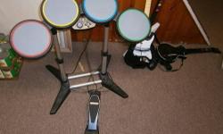 Guitar hero three guitars and drums and a microphone **NO GAME** $50.00 call 631669-9188 pick up only