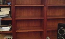 Hand crafted in a workshop in Sag Harbor New York by Hal McCusick. Shaker style solid cherry bookshelves, great for a library or living room. Shelves are also adjustable to fit any size book or piece you want to display. Complete with an oil and wax