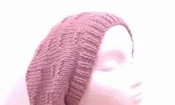 Available at: http://www.CaboDesigns.etsy.com
This hand knit slouch hat is a beautiful soft pink color dusty rose. Hats for women. The beanie beret is made with a soft acrylic yarn. The pattern is ?tracks? knitted through the hat. Very stretchy, will fit