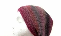 This knit beanie slouch stretches out to 31 inches around. The colors in this handmade beanie are a blend of grape, purple and gray. The yarn is 53% wool and 47% acrylic. Very soft. The measurements of this hat are laying flat on a table are across the
