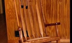 Designed and handcrafted by local woodworker,
These rocking chairs are made of cherry wood with walnut accents
This is a beautifully balanced chair with a smooth rocking motion and finished in tung oil to bring out the beautiful natural grain and color.