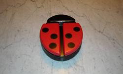 Handcrafted Ladybug Keepsake box
Features wings that slide open to reveal compartments for jewelry and other small items
A great anytime idea
measures 8 x 6.5 x 2