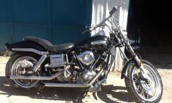 For sale Harley SUPERGLIDE shovelhead updated with elec. ignition, 32amp charging system, custom laughing skull paint job, motor freshened.. bored, mild cam, forward controls, updated, clean and dependable old kicker, way too much to list.. Call Ron