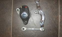 Harley davidson front Springer brake. All bearings and bushing in good condition. Was used on a DNA Front end. works with a 3/4 axle.