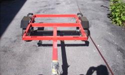 This heavy duty steel utility trailer features built-in slots to place your own side panels and built-in DOT-approved lighting for safety while driving. Just hitch it up to a vehicle with a 1-7/8" ball hitch and this utility trailer will roll securely on