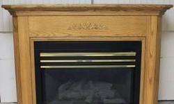 Heatiliator -48 inch Natural Gas Fireplace Insert (can be converted to propane as well). This unit is 35,000BTU and will easily heat 1,500 square feet of space. The unit also has the optional electric blower.
With the solid oak surround the entire
