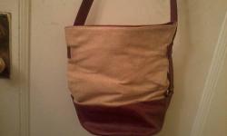 Selling a Vintage Henri Bendel Handbag ,the bag is half linen and half brown leather with attached purse inside. Comes from a Smoke Free House. More Photos Upon Request.
E-mail me if interested with Your Name and Phone Number so i can return your Reply .