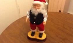 Hip Swinging Santa - Sings and Sways to the Music! Dances to "Santa Clause is Coming to Town" Arms Move Up and Down! Push Button Activated - $14.00
Merry Christmas Reindeer on a short stick that sings "Santa Clause Is Coming To Town" - $5.00