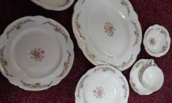 This is for a set of Homer and Laughlin made in the USA china there are 8 of everything coffee cups saucer,cake plates lag plates except the soup bowls there are 7 also a bowl creamer sugar platter there is a gravy boat that is cracked but you can display
