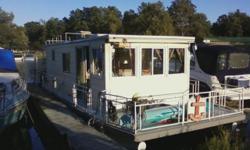 Own your own vacation spot that you can drive!
'87 Waterways houseboat. 15 beam by 38' length houseboat on steel pontoons (11' of living space), 2' walk around deck (front and rear decks also) w/spacious upper deck for lounging. 4 cl Mercury I/O. Living