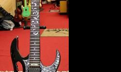 Ibanez JEM555 Black Steve Vai Signature Electric Guitar
The Ibanez JEM555 is a JEM series electric guitar model and signature model of American guitarist Steve Vai. The JEM555 features the US made DiMarzio Evolution pickups also used for high end models.