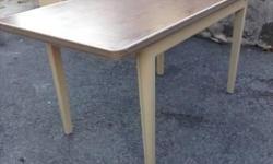 Are you looking for a table that's virtually indestructible? If so, you can't go wrong with a metal tanker table from the industrial age. Good condition. Very sturdy. Use as-is or consider spray painting to match decor. Professionally refinished you'd pay
