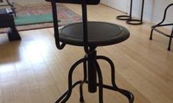 Lightly used metal industrial stool with backrest. Seat height adjusts from 24-28". Back height 37.25- 41.25". 15" diameter seat. Gunmetal grey with black faux or real leather on seat and back. Price is for all 4. In very good condition.