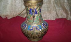 This large, vintage Japanese Bronze Enamel Cloissone Vase would be a great addition to your collection. It is enameled with dragons and flowers and has a dragon handle on each side. It has great color and measures 12 inches high and 8 inches at its widest