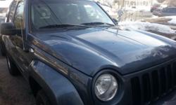 Blue jeep liberty 2002 new wheels and engine 4 door 4x4 great for both winter and summer and far away travels automatic