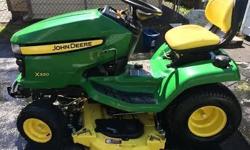 2009 John Deere X320 Lawnmower with 48 inch "Edge Extra Mowing System" mowing deck. Immaculate condition. Service up to date. New belt and blades on mower deck. 44 inch Snowblower attachment with weights and tire chains. Runs like new... downsizing due to