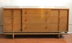 An original Mid-Century case piece by Kent Coffey from the Sequence collection. Made of bleached mahogany and walnut. It has plenty of storage with three drawers in the middle and three on each side. The handles are brass. The mirror is ready to hang on