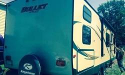 2014 ultra lite travel trailer only used a couple times. 1 slide. queen bed in front and 4 bunks in back. Stove w/oven. Refrigerator with freezer, microwave, bathroom with tub toilet and sink. Electric 16 ft awning, electric jack. Lots of storage. Sleeps