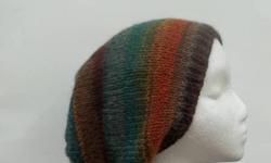 The colors in this knit beanie beret slouchy are several shades of brown, rust, teal, green, dark orange, a large variety of colors. Very stretchy, will fit any head, stretches out to 31 inches around.All hand knitted hats at: