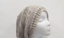 This hand knit beanie slouch colors are shades of tan and light brown. A warm beanie. The beanie beret is made with acrylic 80% and wool 20%yarns. Very stretchy, will fit any head, stretches out to 31 inches around. The measurements are lying flat on a