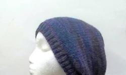 The colors of this slouch hat are shades of lavender and purple. The beanie beret is made with a soft acrylic yarn. Very stretchy, will fit any head, will stretch out to 31 inches around. The measurements are laying flat on a table, across the brim or