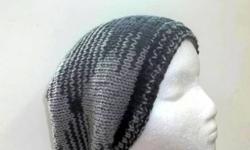 The colors of this slouch hat are a medium gray with four black stripes. The beanie beret is made with a soft acrylic yarn. Very stretchy, will fit any head, stretches out to 31 inches around. The measurements are laying flat on a table, across the brim