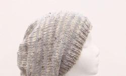 The colors of this slouchy beanie hat are tan and grey small stripes (1/2 inch). An interesting texture in this slouch hat that the yarn has tiny flecks of dark brown and light brown worked into it. This slouch hat is a medium thickness, very stretchy,