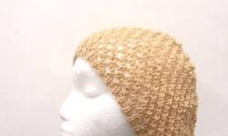 Available at: http://www.CaboDesigns.etsy.com
This open weave beanie slouch hat is the color of champagne beige. Very airy and lightweight. It is knitted with a very soft acrylic yarn. The yarn has scattered small sequins that are the same color as the