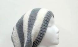 This is the perfect for winter, autumn, spring, comfortable warm and stylish! The knitted slouchy beanie hat colors are a medium grey and white. It is hand knitted in 1 Â½ inch stripes . Suitable for men or women. Will fit any head, will stretch out to 31