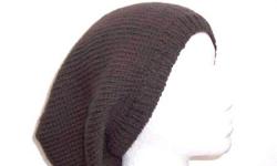 The color of this knitted slouchy hat is a nice dark brown. This beanie beret is made with a soft pure wool yarn. It is a medium thickness, very stretchy, will fit any head, will stretch out to 31 inches around. The measurements are laying flat on a table