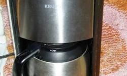 I have here for sale a like new Krups Programmable 10-Cup Coffee Maker with double wall thermal carafe and Blue LED control panel,
Stainless Steel and Black
Fully programmable 1100-watt coffeemaker brews up to 10 cups
BLUE LCD display; clock/timer; 1- to