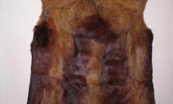 THIS FUR COAT HAS NO TAG ON IT. IT APPEARES TO BE A LADIES LARGE SLEEVELESS TYPE THAT MAY HAVE BEEN ALTERED FROM AN OLDER COAT. THE LINING MAY HAVE BEEN REPLACED IN THE PAST AND DOES NEED SOME SOWING ON THE COLLAR. (STITCHING ON COLLAR BINDING--SEE
